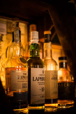 Bucharest, Romania - February 19, 2019: Illustrative editorial image of various bottles of Alcohol displayed in a pub in Bucharest, Romania.のeditorial素材