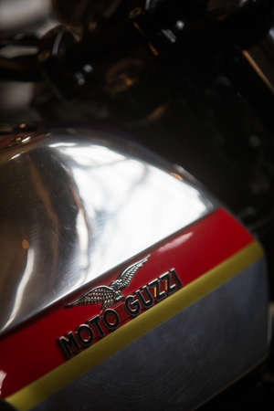 Mandello del Lario, Italy - May 24, 1019: Illustrative editorial close up shot of the Moto Guzzi logo on a vintage motorcycle tank. Moto Guzzi is an Italian motorcycle manufacturer.のeditorial素材