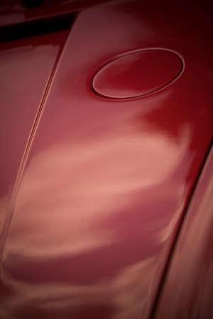 Close up shot of a fuel cap on a vintage car.の写真素材