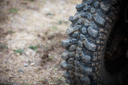 Close up shot of a muddy off road tire on a 4x4 car.の写真素材