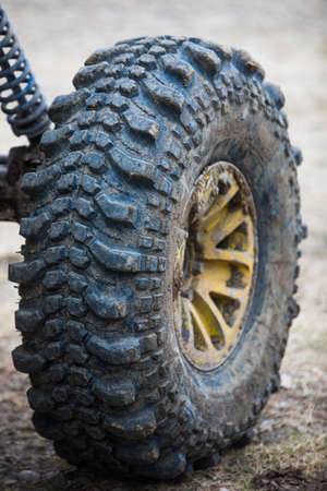 Close up shot of a muddy off road tire on a 4x4 car.の写真素材