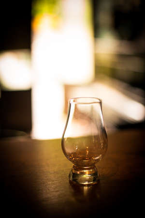 Close up shot of an empty Glencairn whisky glass.の写真素材