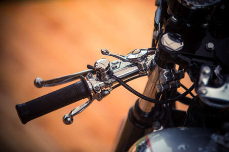 Close up shot of a vintage motorcycle lever.