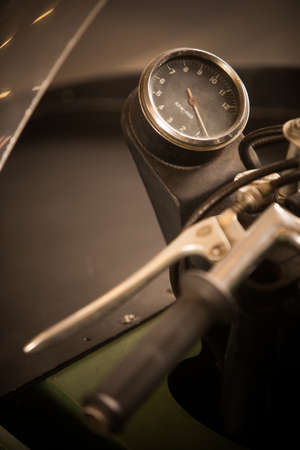 Close up vertical image of the tachometer gauge of a vintage motorcycle.の写真素材
