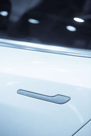 Close up shot of a white car door handle.の写真素材