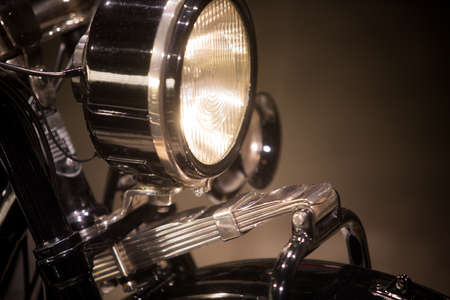 Color image of a classic motorcycle headlight.