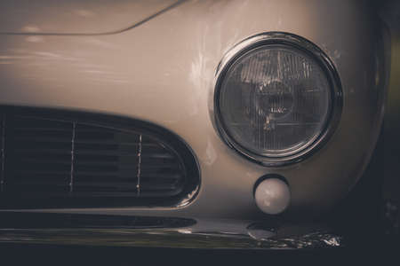 Close up horizontal image of the headlight of a vintage classic car.の写真素材