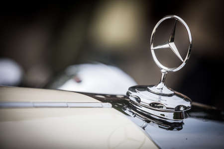 Mandello del Lario, Italy - May 26, 1019: Illustrative editorial close up shot of the Mercedes Benz logo on a vintage car hood. Mercedes Benz is a German global automobile maker.のeditorial素材