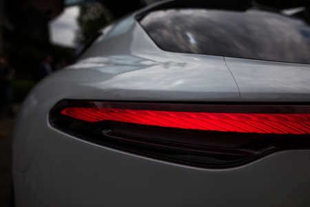 Close up horizontal image of the LED tail lights of a new sport super car.