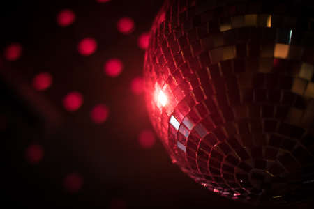 Color image of a shiny disco ball in a night club.の写真素材