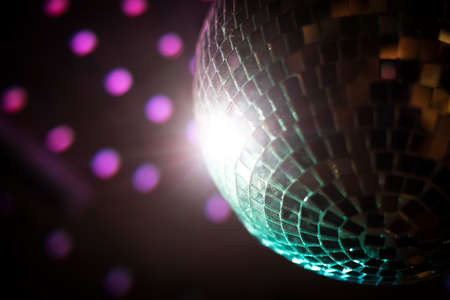 Color image of a shiny disco ball in a night club.の写真素材