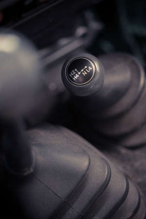 Close up image of a 4wd car's 4x4 shifter.