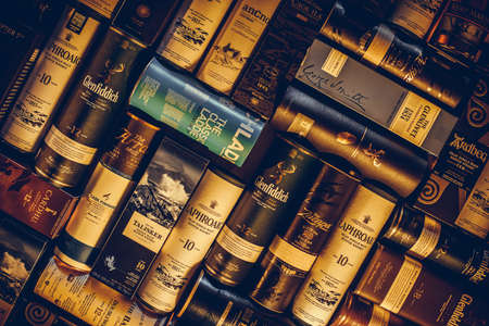 Bucharest Romania - January 27, 2020: Various whisky bottle packages of are displayed in bar in...