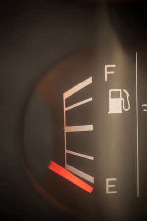 Close up shot of a car's fuel gauge.