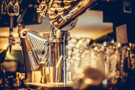 Bucharest Romania - January 27, 2020: Illustrative editorial shot of a Guinness beer tap, in a pub...