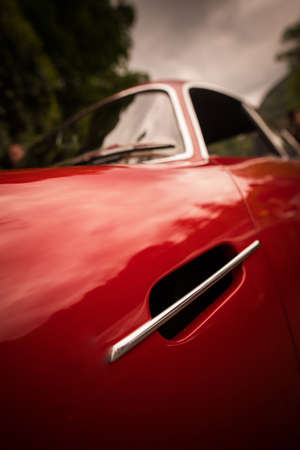 Color close up of the air vent on a vintage classic car hood.の写真素材