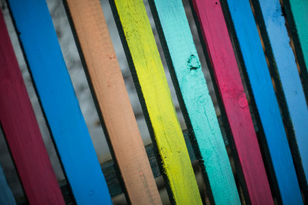 Close up shot of some wood planks painted in various colors, background concept.の写真素材