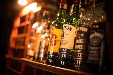 Bucharest, Romania - December 2, 2020: Illustrative editorial image of various whisky bottles displayed in a pub in Bucharest, Romania.のeditorial素材