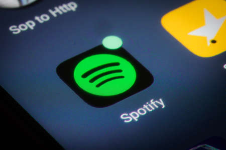 Bucharest, Romania - December 13, 2020: Illustrative editorial close up image of the Spotify mobile...