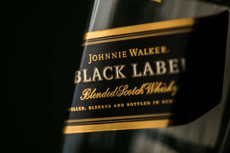 Bucharest, Romania - November 9, 2020: Illustrative editorial image of a Johnnie Walker Black Label blended scotch whisky bottle displayed in a pub in Bucharest, Romania.のeditorial素材