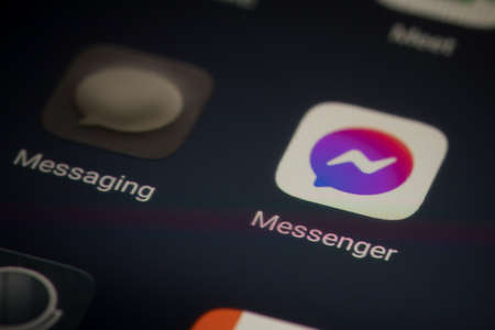 Bucharest, Romania - December 13, 2020: Illustrative editorial close up image of the Facebook messenger mobile app on a smartphone screen.のeditorial素材