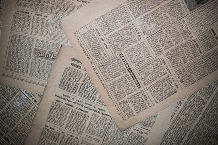 Bucharest, ROMANIA - May 18, 2021: Image of some old newspapers, background.のeditorial素材