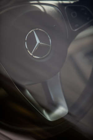 BUCHAREST, ROMANIA - October 10, 2021: Illustrative editorial image the Mercedes Benz logo on a steering wheel.のeditorial素材
