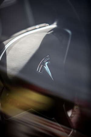 BUCHAREST, ROMANIA - October 10, 2021: Illustrative editorial image the Tesla logo on a steering wheel.のeditorial素材