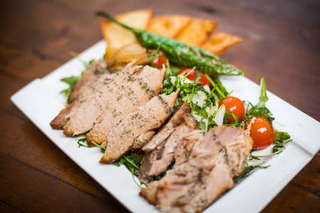 Close up shot of a salad with beef and roasted vegetables, on a plate.の写真素材