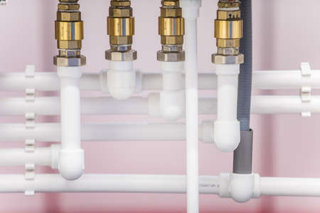 Image of various PVC pipes and fittings.