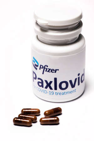 Bucharest, Romania - February 1, 2022: Illustrative editorial concept image of oral antiviral drug pill Paxlovid developped by Pfizer. Corona virus Covid-19 treatment.のeditorial素材