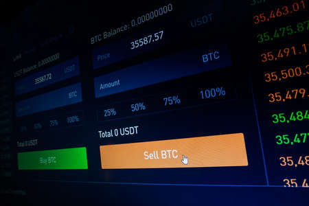 Close up shot of a computer screen with the mouse cursor on the Sell Bitcoin button.