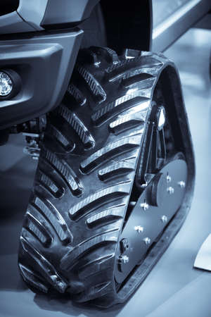 Image of caterpillars on a car instead of wheels, for driving in the snow.