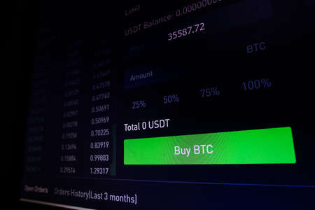 Close up shot of a computer screen with the mouse cursor on the Buy Bitcoin button.