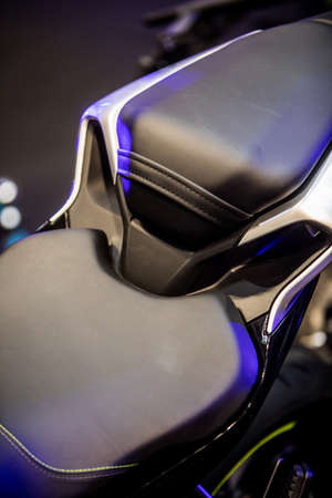Close up shot of a new sport motorcycle leather seat.