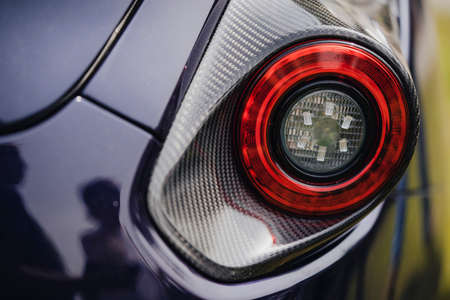 Close up shot of a modern sports car rear stop lights.の写真素材