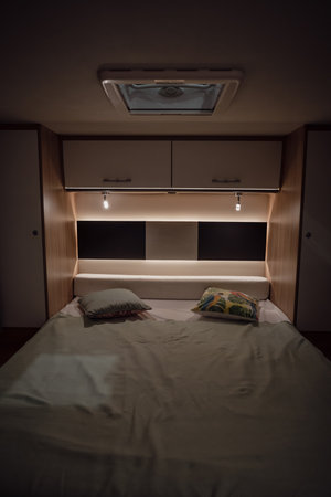Image of the bed inside a new luxury camper van motorhome.の写真素材