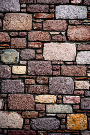 Vertical shot of stone tiles wall, background, texture, pattern.の写真素材