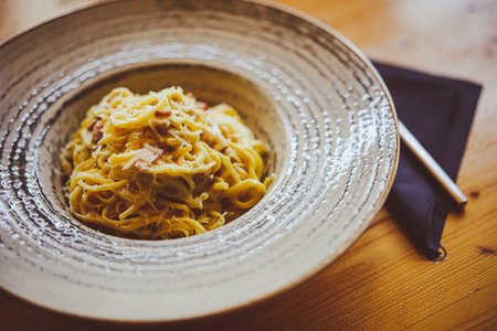 Close up shot of a spaghetti carbonara pasta in a plate.の写真素材