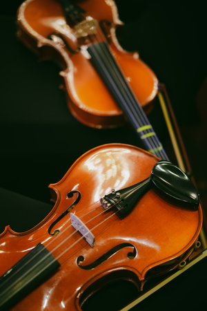 Detail view of two violins on some chairs.の写真素材