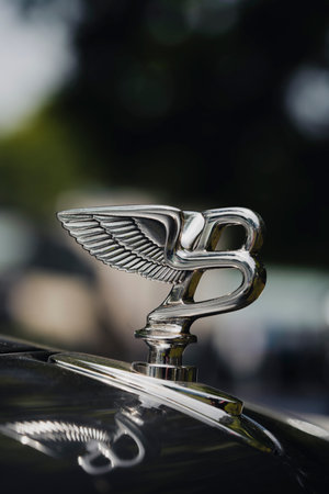 Como, Italy - May 22, 2022: Close up illustrative editorial image of Bentley logo statuette on a...