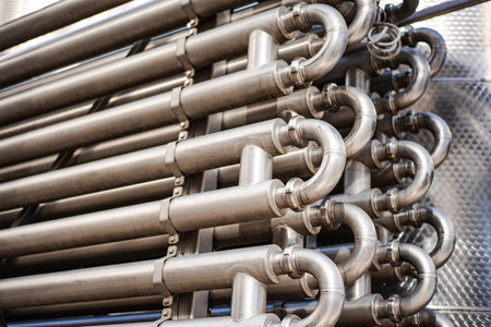 Close up shot of metal pipes in a factory.