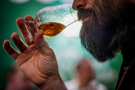 A man holding a single malt whisky glass.の写真素材