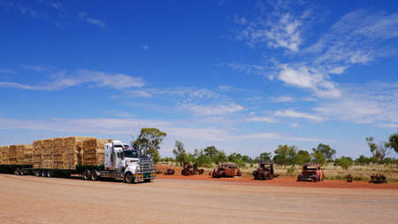 road train transporting hay stop overの写真素材