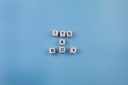 blue background with text - its a boy. concept for celebrating a newborn boys birthday or a party.