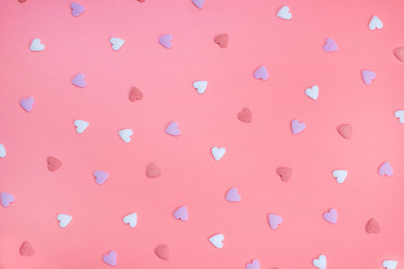 background of hearts on a pink background. The concept of love or celebration of a party, anniversary, valentines day, in pink colorsの写真素材