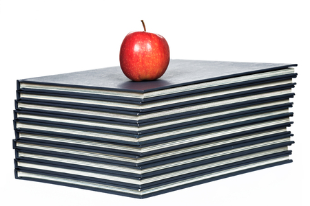 Stack of books with red appleの写真素材