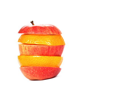 Sliced red apple and orange