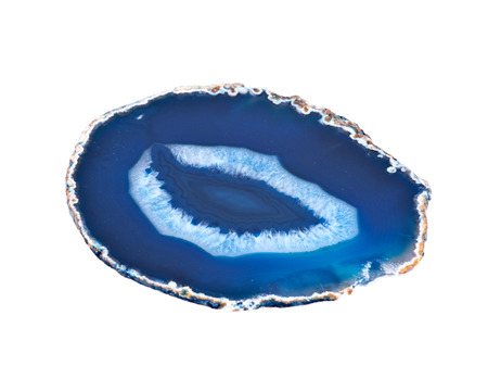 Thin slice of agate geodes with concentric layers separated on white background