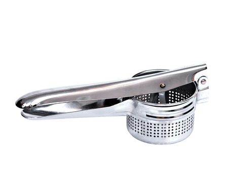 Stainless steel potato ricer separated on white backgroundの写真素材